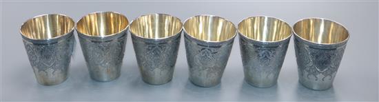 A set of six Persian engraved white metal beaker cups, 562 grams.